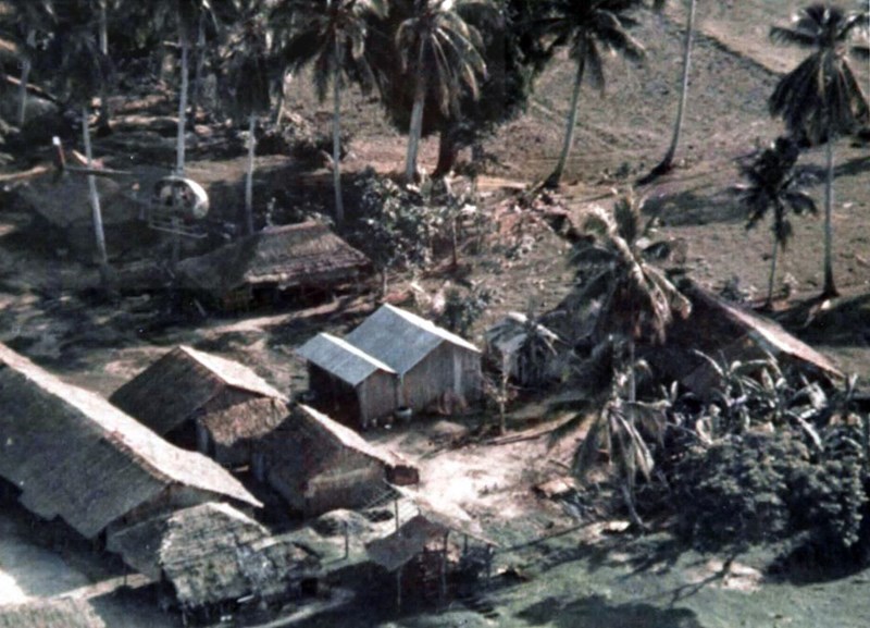 An OH-6 “Loach” flies low over a village searching for Viet Cong forces, unknown date. (National Archives)